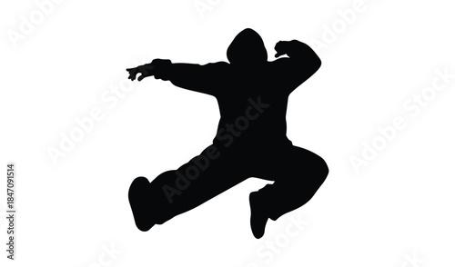 Dynamic black silhouette of a breakdancer mid-jump, capturing the energy and athleticism of hip-hop dance.