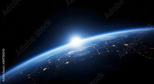 Earth from space sunrise over city lights planet globe
