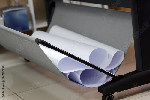 Plot plan drawing roll paper. Professional large format plotter at an engineering office.