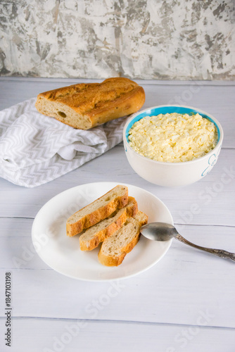 Whole grain baguette made from buckwheat flour and sesame seeds, and salad with egg