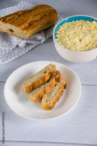 Whole grain baguette made from buckwheat flour and sesame seeds, and salad with egg