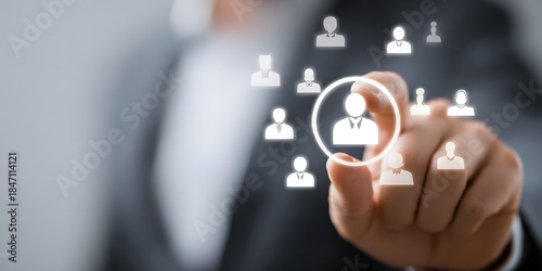 Human resource manager hand holding icon to select one employee minimalist business icon