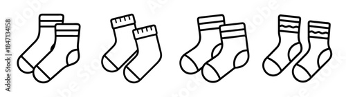A collection of four minimalist black and white line art icons depicting pairs of socks