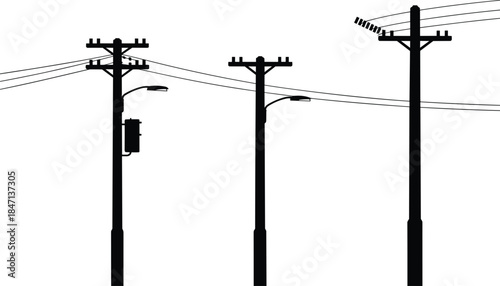 Silhouettes of Three Utility Poles with Power Lines and Streetlights electricity infrastructure