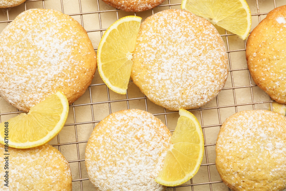 Naklejka premium Tasty lemon cookies with fruit slices on white table, top view
