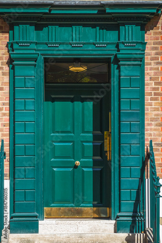Traditional green door to a 18th century Georgian house in London, UK