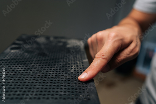 Computer technician checking dust accumulation on desktop case, preventing potential overheating and maintaining system performance with careful cleaning process. Concept of service, cleaning PC.