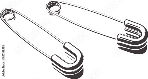 Two metallic safety pins a white silver
