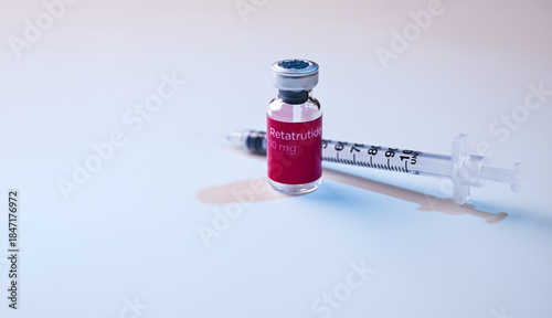 Close up of Retatrutide Glass Vial and Single Use Insulin Syringes