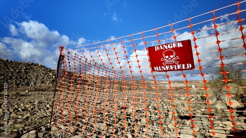 Photos Danger minefield sign with a skull and crossbones symbol attached to an orange p