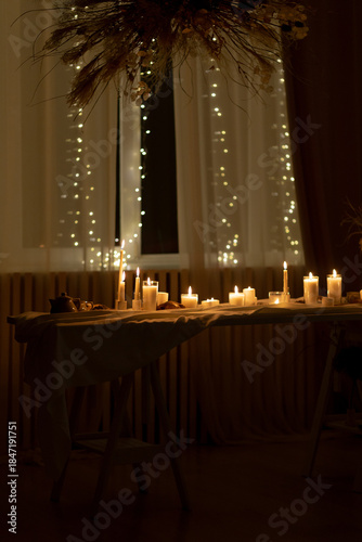 Candlelit dinner table with fairy lights