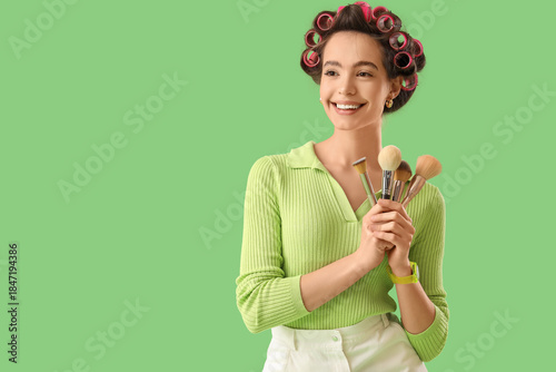 Young woman with hair curle...