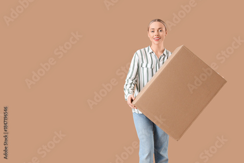 Young woman with parcel box...