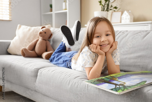 Cute little girl reading st...
