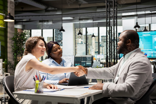 Tableau sur toile Handshake between HR manager and candidate for filling in the new position, legal terms and paperwork completed as the new employee prepares to join the team and start a successful career