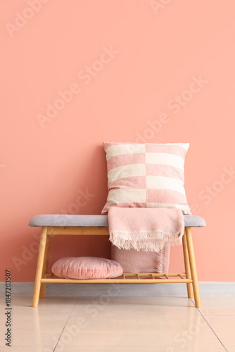 Grey bench with cushions an...