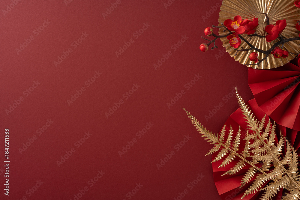 Fototapeta premium Vibrant red backdrop with gold accents and botanical fern elements captures a Chinese New Year greeting scene ideal for seasonal campaigns and cultural celebration visuals
