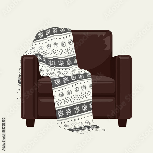 Cozy armchair with festive winter blanket draped over it in a minimalistic home setting
