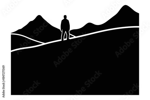 Solitary hiker stands atop a dark hill overlooking distant mountain silhouettes