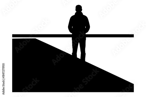 Silhouette of person standing on steep slope behind a safety railing barrier