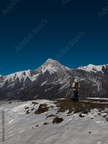 Person Standing with Back View Facing Mount Gongga Snow Mountains, China