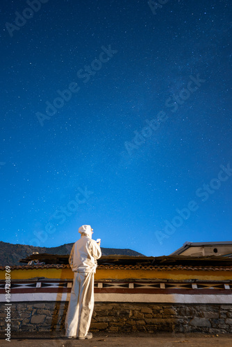 Silhouette of a Person Facing the Milky Way in Starry Night Sky