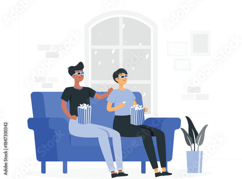 Two people sitting on a blue couch watching a movie together at home with snacks and virtual reality glasses.