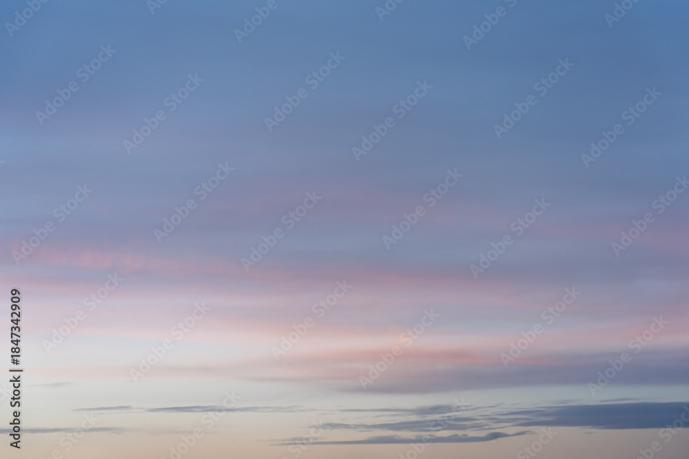 Obraz premium Soft Pink and Blue Sunset Sky with Clouds