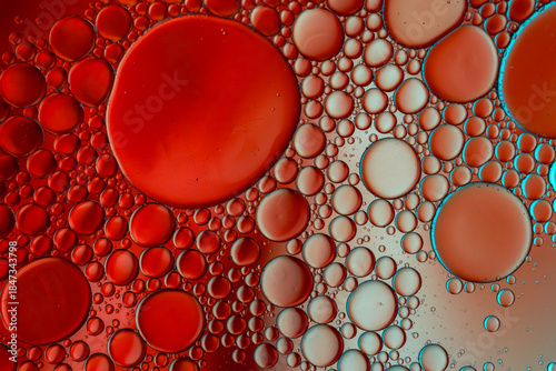 Close up of oil drops on water surface. Colorful abstract macro background of oil drops on water surface with air bubbles inside. Colorful background for gadget and computer wallpaper