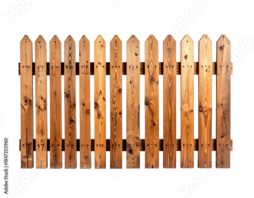 A wooden fence with pointed tops against a black background