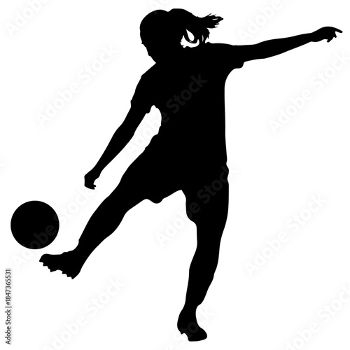 Silhouette of a Female soccer player kicking the ball