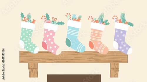 Colorful Christmas stockings with holly hang from a wooden mantelpiece on Christmas Day against a pale background.