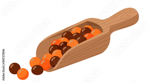 Wooden Scoop Filled with Chocolate and Orange Candy Balls