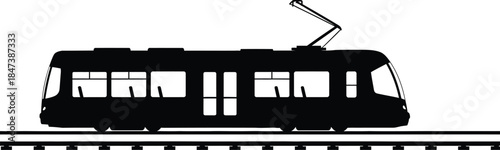 Silhouette of a modern electric tram moving along railway tracks