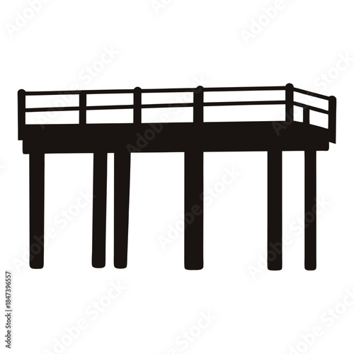 Silhouette of a wooden pier or platform structure with fence railing