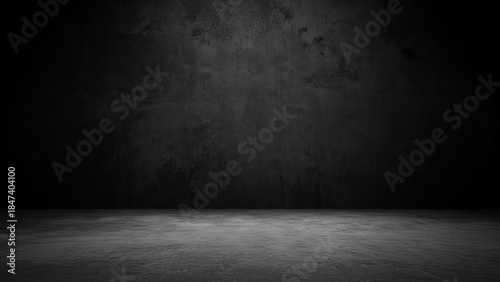 Dark textured concrete background with a spotlight effect, ideal for product display or dramatic scenes