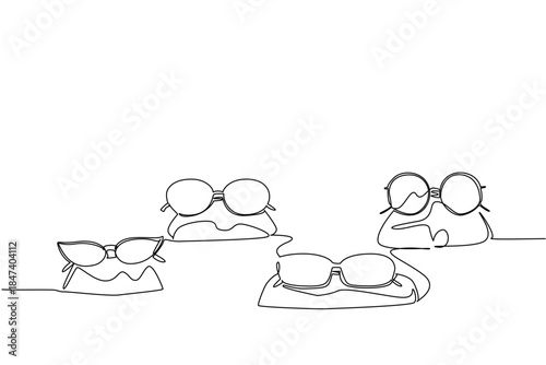 Continuous line drawing of assorted glasses and sunglasses displayed on stands, representing fashion versatility and the importance of vision care during National Eyewear Day fashion and eye health
