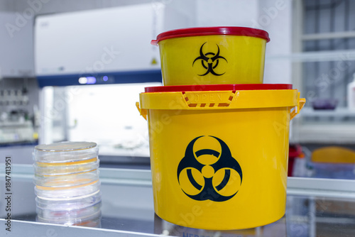 Small and large biohazard waste containers for microbiology lab work. Containers for collecting used laboratory instruments.