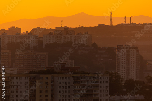 Urban development of Vladivostok at dawn. Bright dawn in Vladivostok.