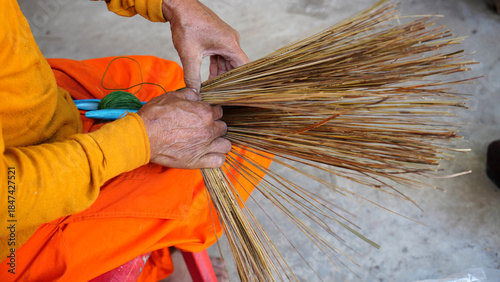 Billede på lærred Traditional Thai handcrafted brooms made from coconut trees.