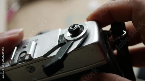 Photographer Hand Pressing Shutter Button on Vintage Film Camera Taking Picture Action Shot