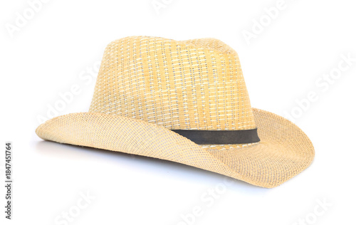  Side view of a natural woven hat featuring a beautiful handcrafted design, isolated on white background.
