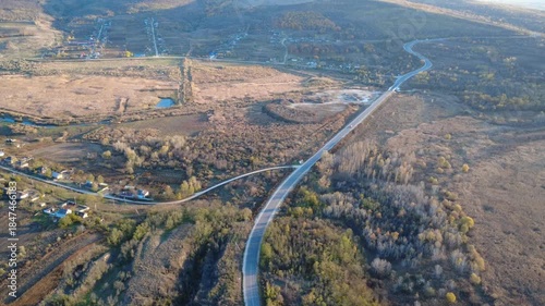 flying a drone over a forest road