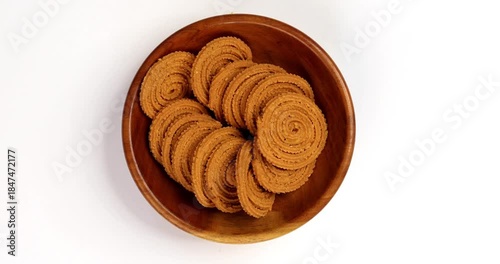 Chakli is a savoury snack from India. It is a spiral shaped snack with a spiked surface