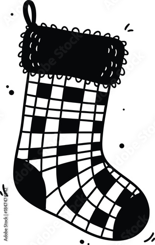A black and white checkered Christmas stocking hanging from a loop
