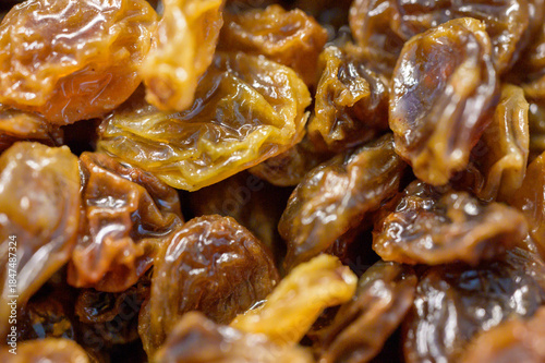 Close up macro shot of dry raisins. Healthy food ingredient in detailed view.