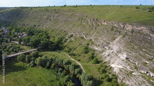 flying a drone above river in Old Orhei and rocks