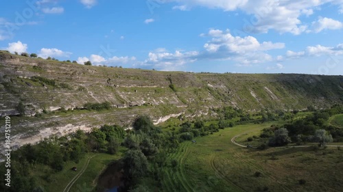 flying a drone above river in Old Orhei and forest