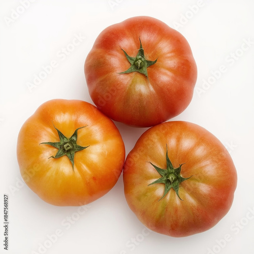 Red, yellow, and green tomatoes with vibrant hues and slight sheen, lying on a pristine white background, captured from a direct top view, rendered as a super realistic photo with intricate details