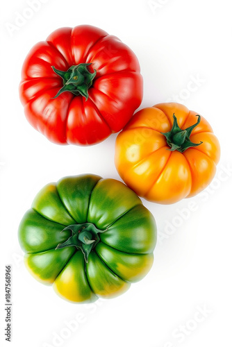 Red, yellow, and green tomatoes with vibrant hues and slight sheen, lying on a pristine white background, captured from a direct top view, rendered as a super realistic photo with intricate details